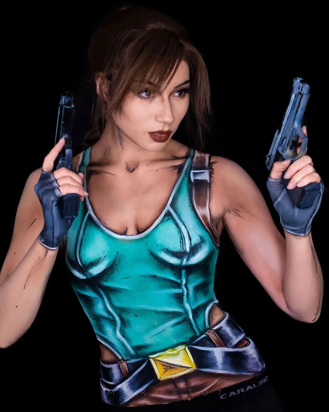 Model cosplays Lara Croft in body paint - Save State